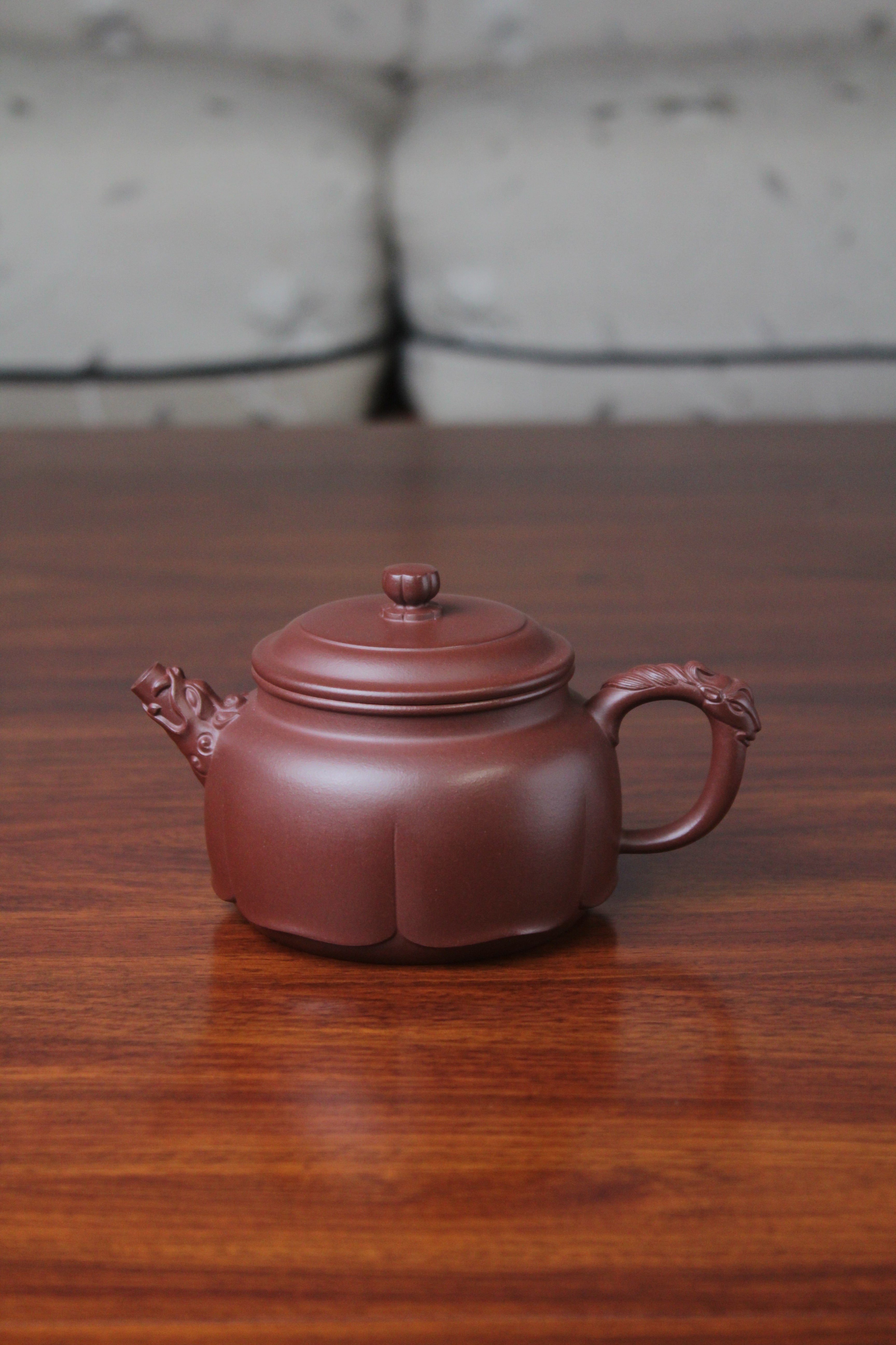 The front of the yixing clay teapot on the table
