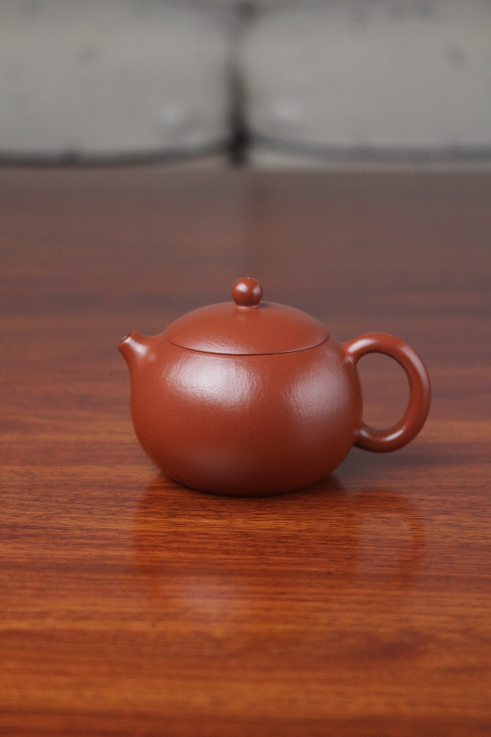 Front view of the yixing clay teapot xishi on the table