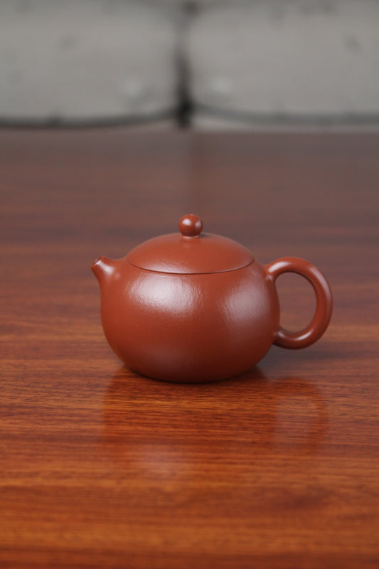 Front view of the yixing clay teapot xishi on the table