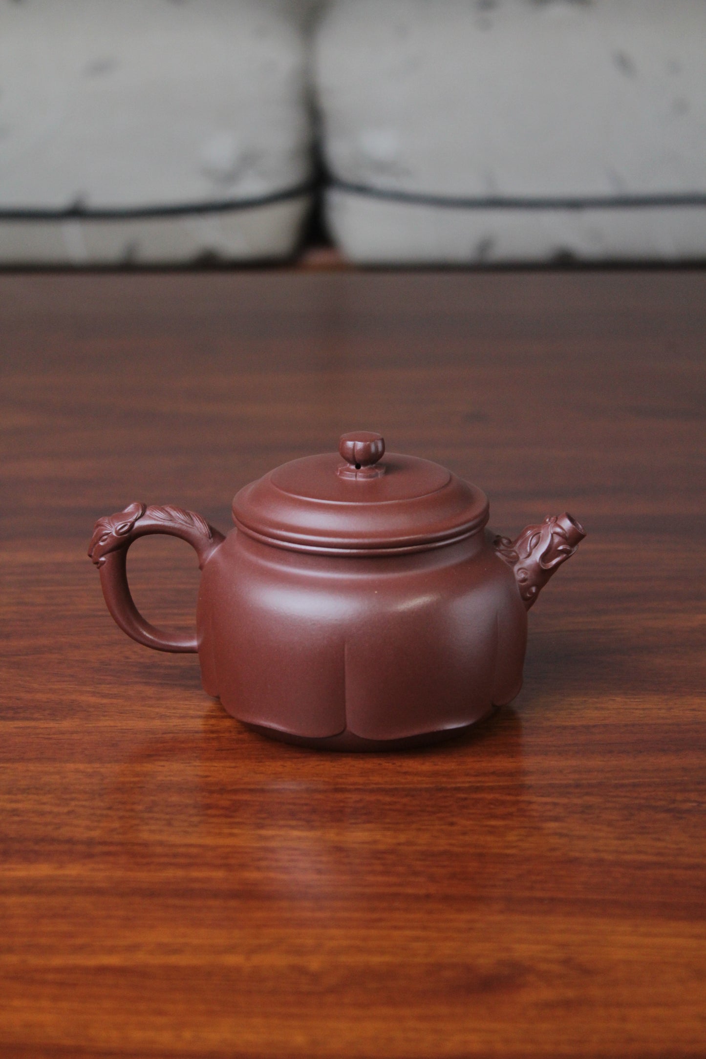The back of the yixing clay teapot on the table