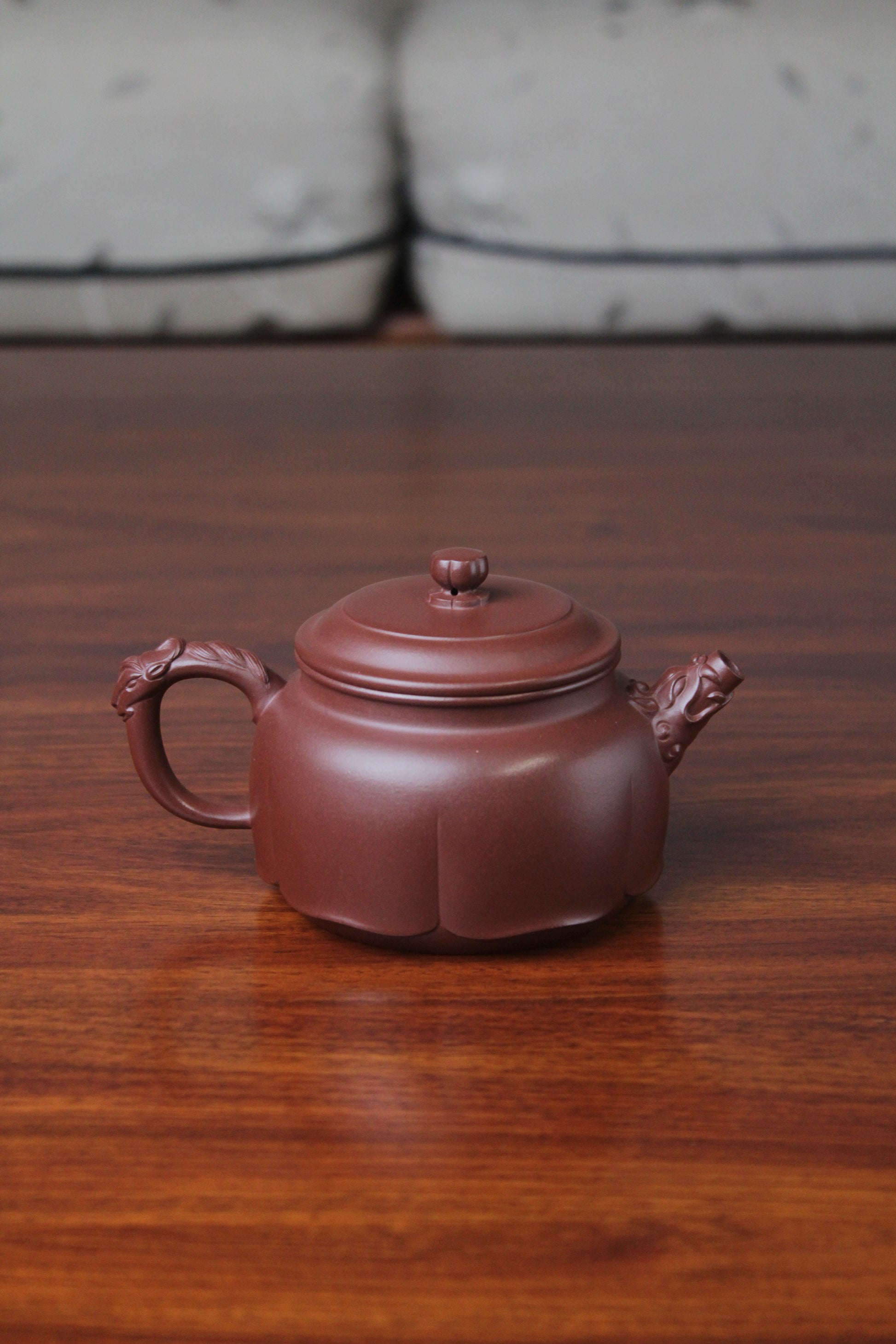 The back of the yixing clay teapot on the table