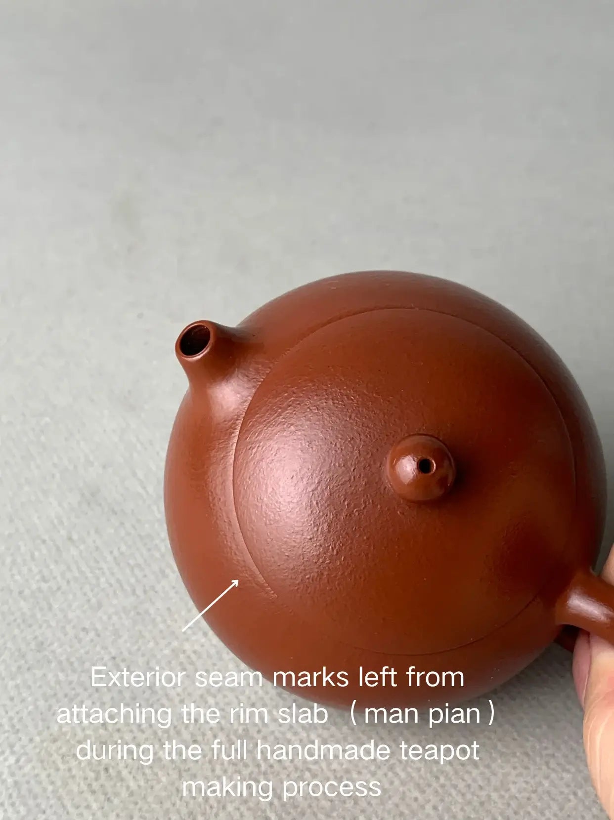 Exterior seam marks left from attaching the rim slab （man pian）during the full handmade teapot making process