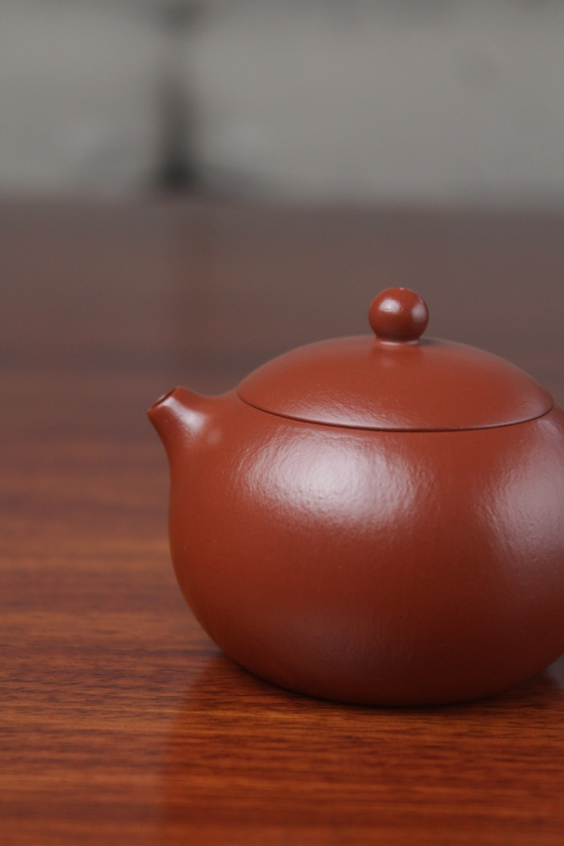 spout of the yixing clay teapot xishi on the table