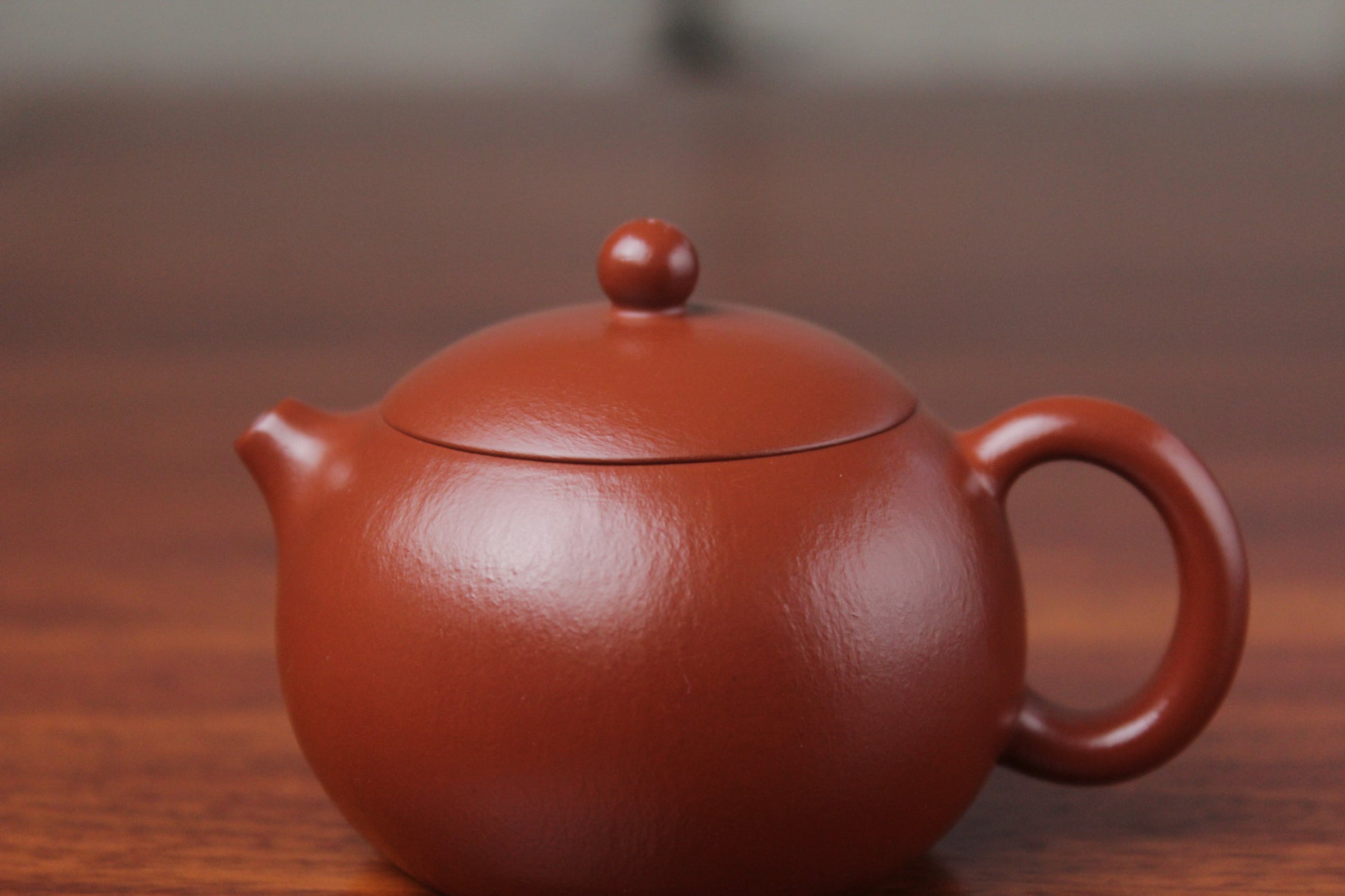 lid detail of the yixing clay teapot xishi on the table