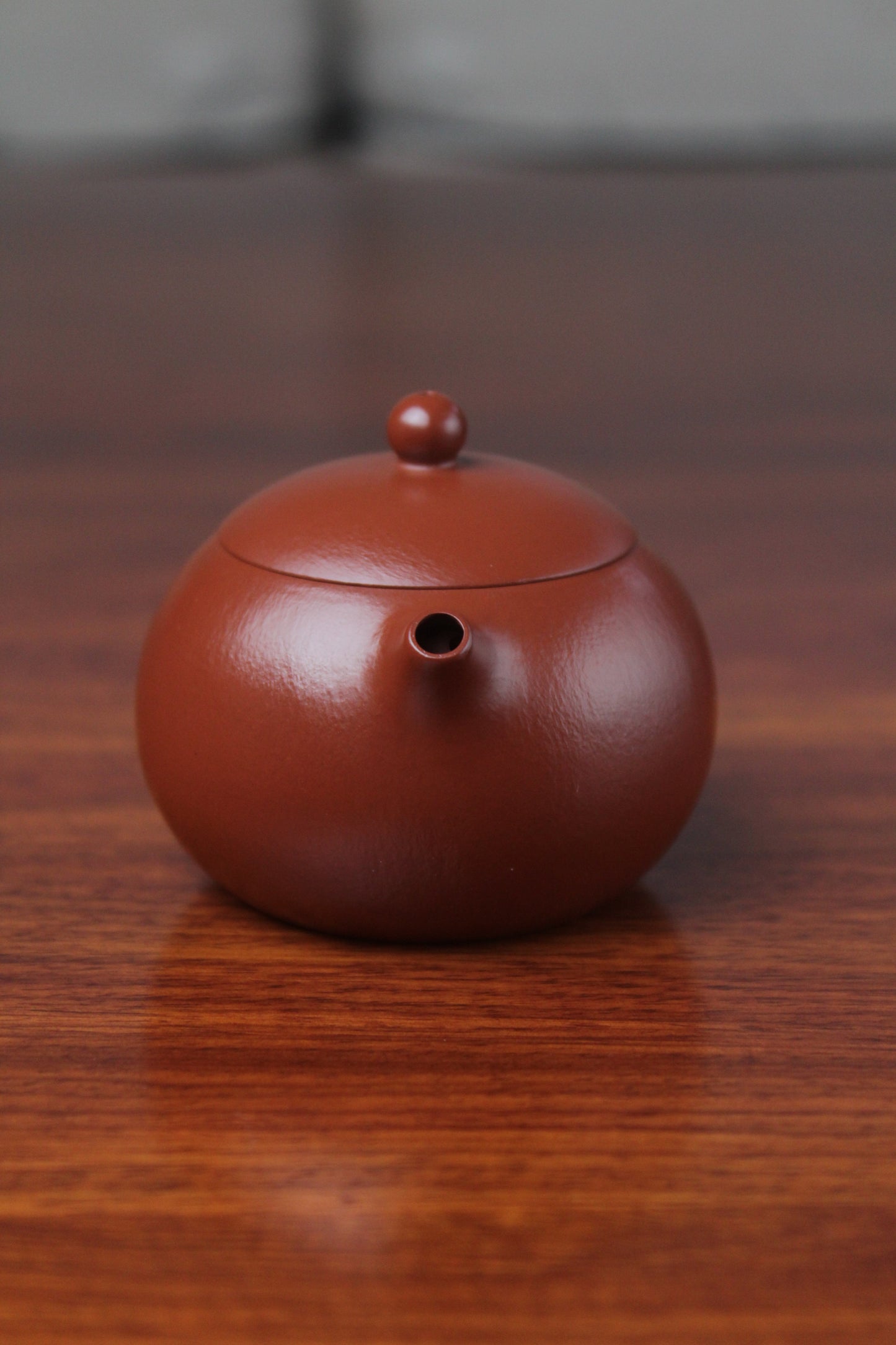 spout of the yixing clay teapot xishi on the table details 