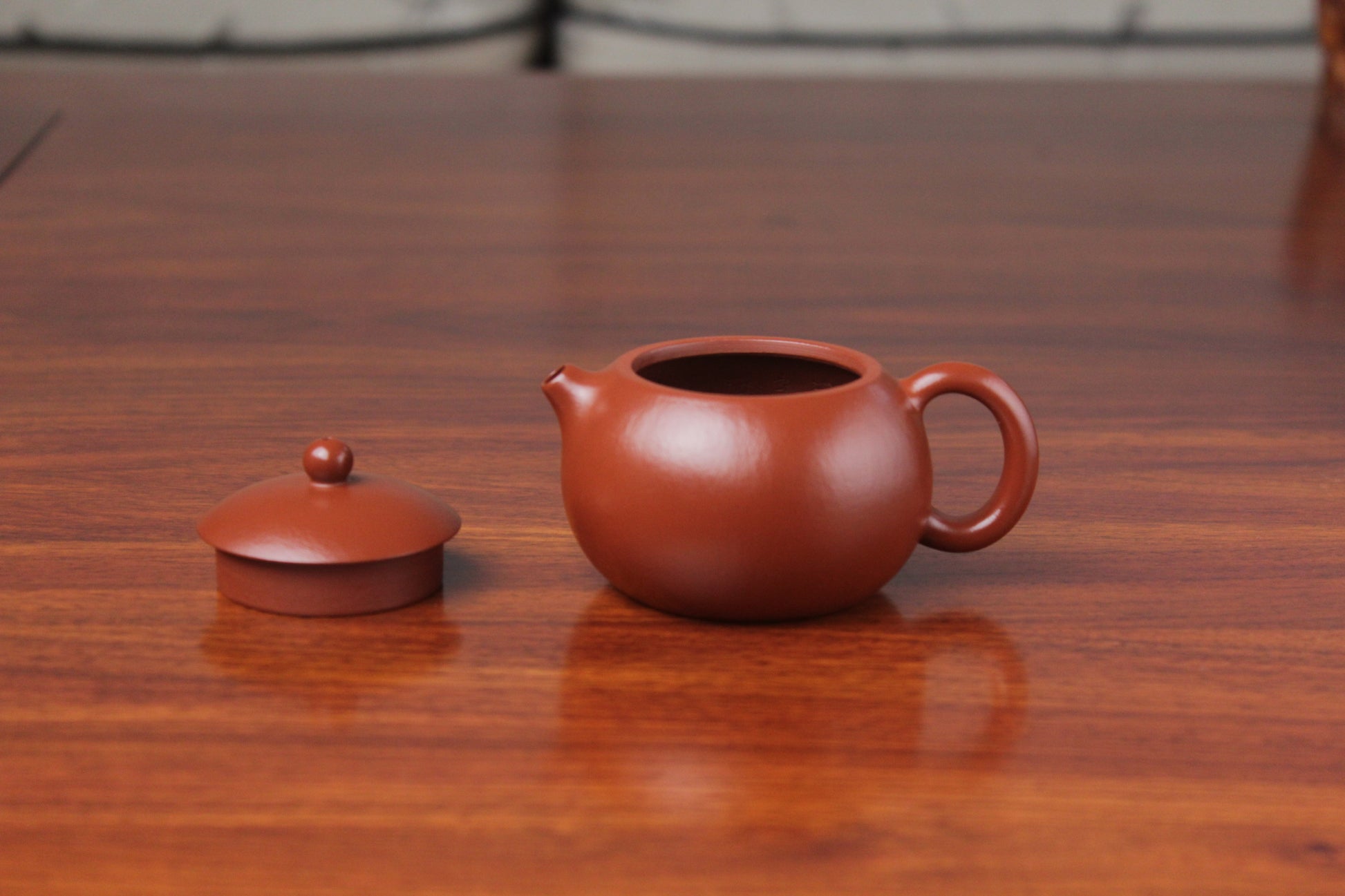 details of the yixing clay teapot xishi on the table