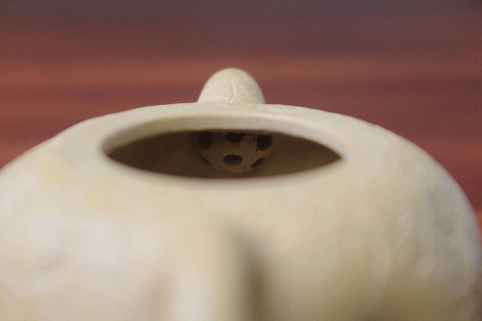 The filter of the yixing clay teapot on the table