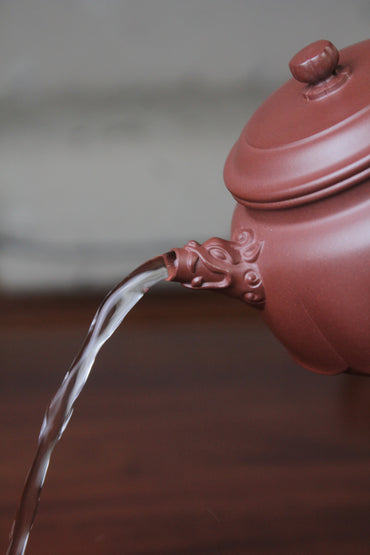 The pour of the yixing clay teapot