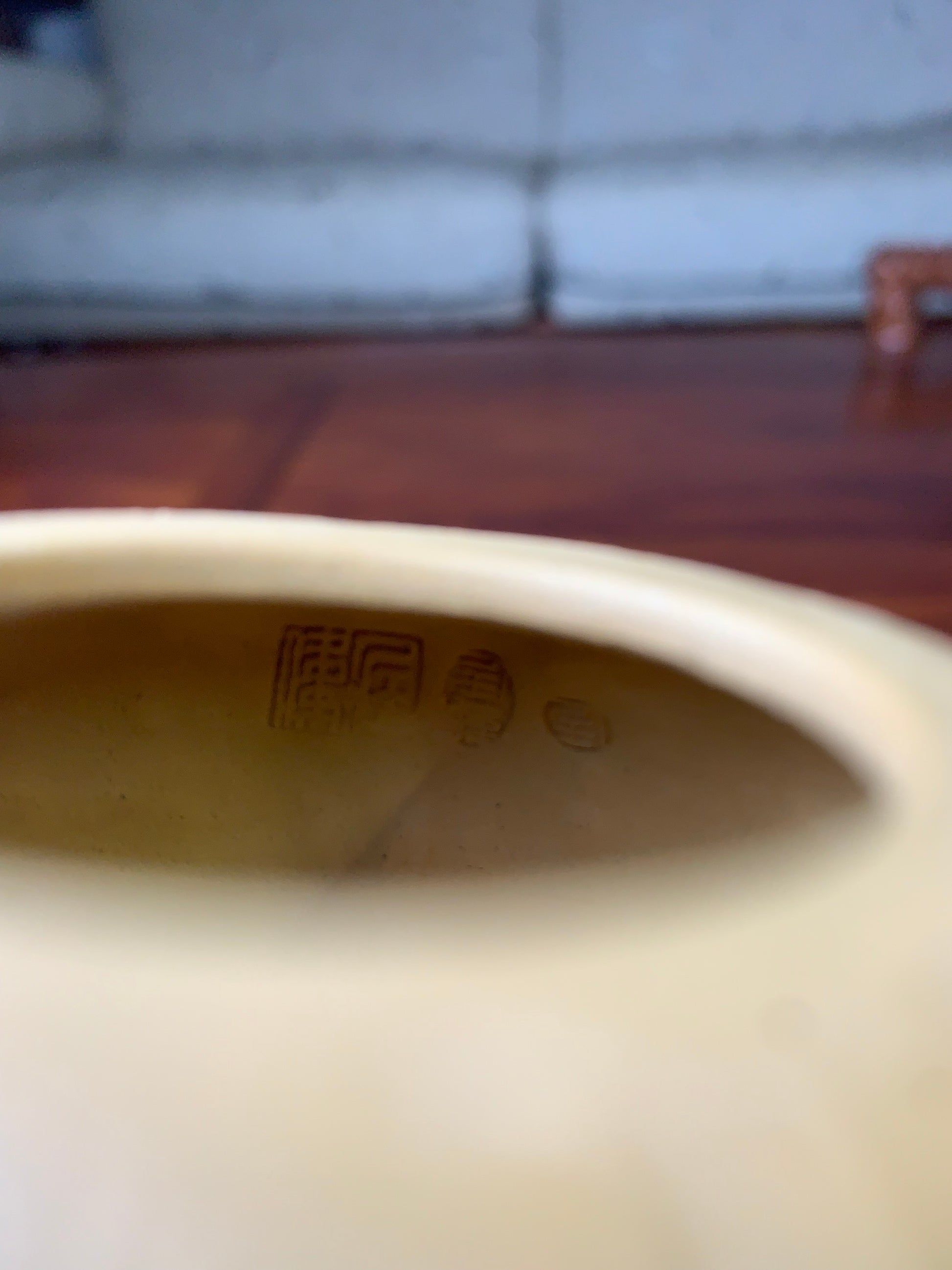 The inside of the yixing clay teapot on the table