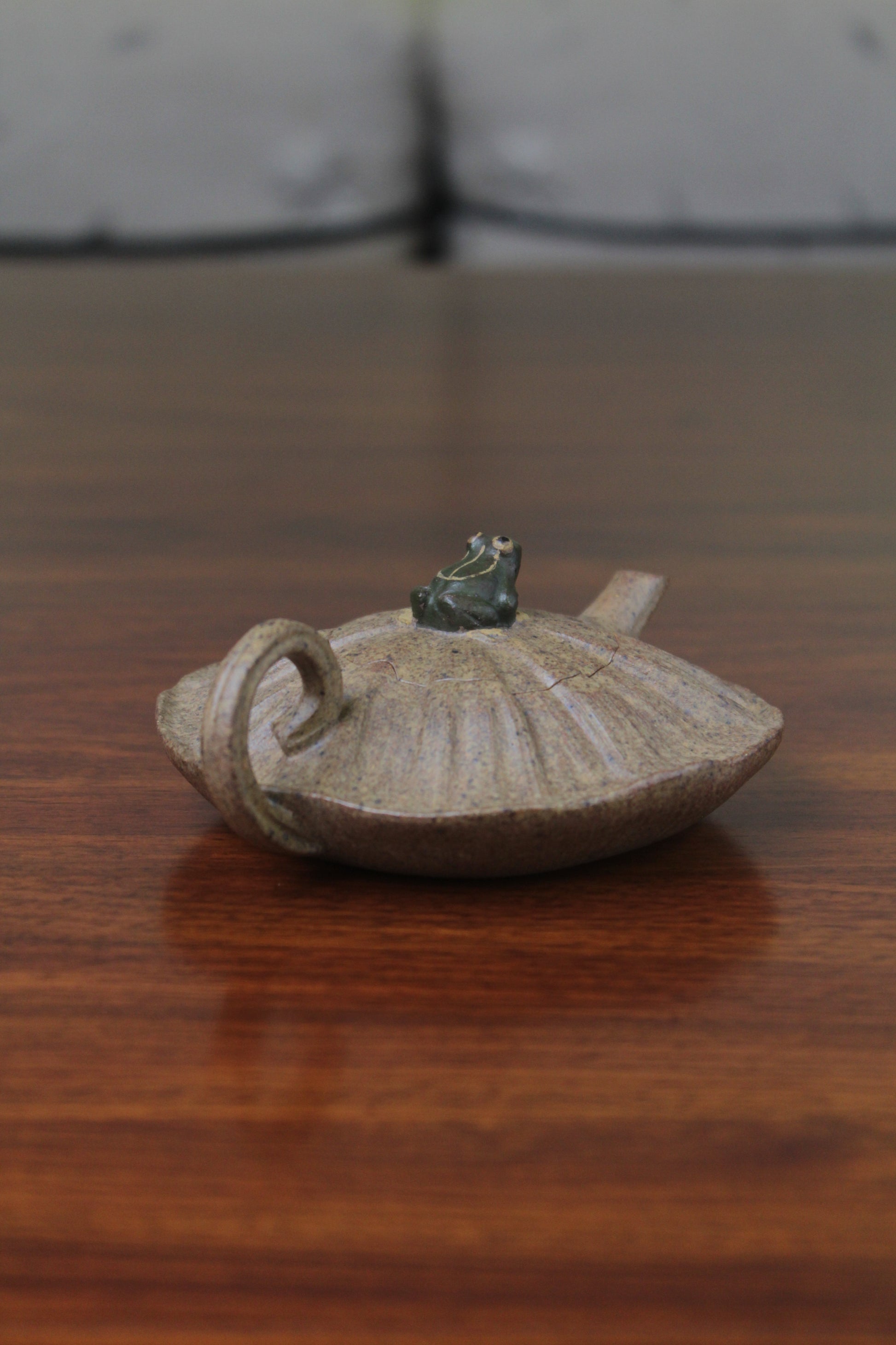 yixing clay teapot handle on the table