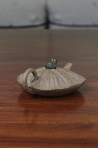 yixing clay teapot handle on the table