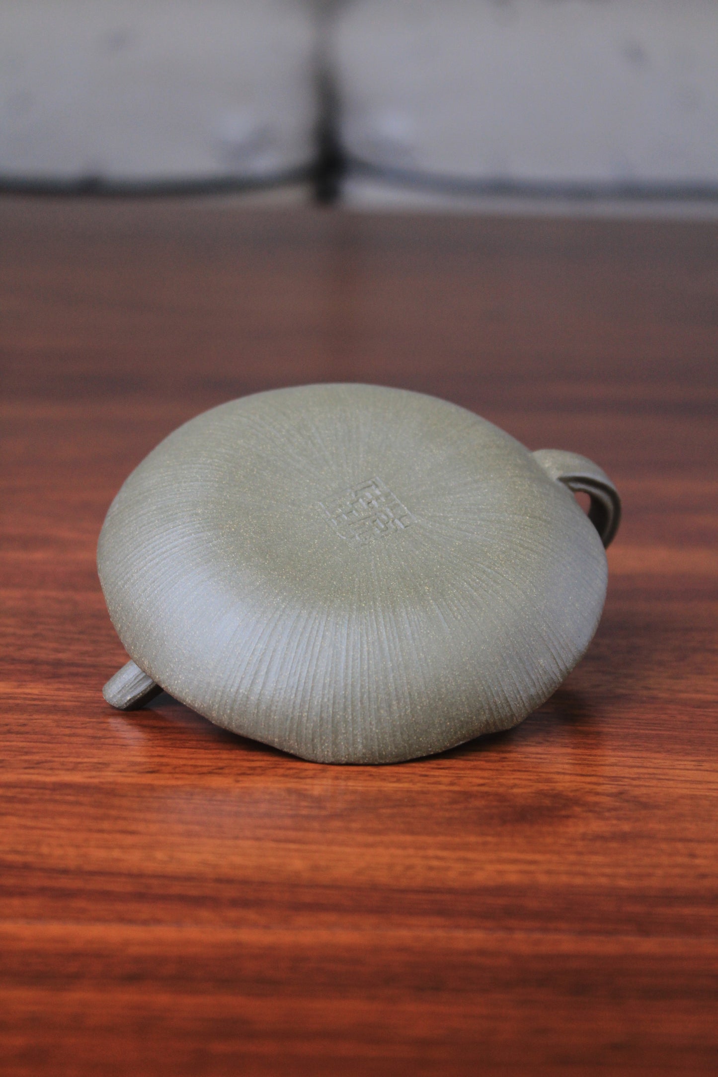 Bottom of yixing clay teapot on the table