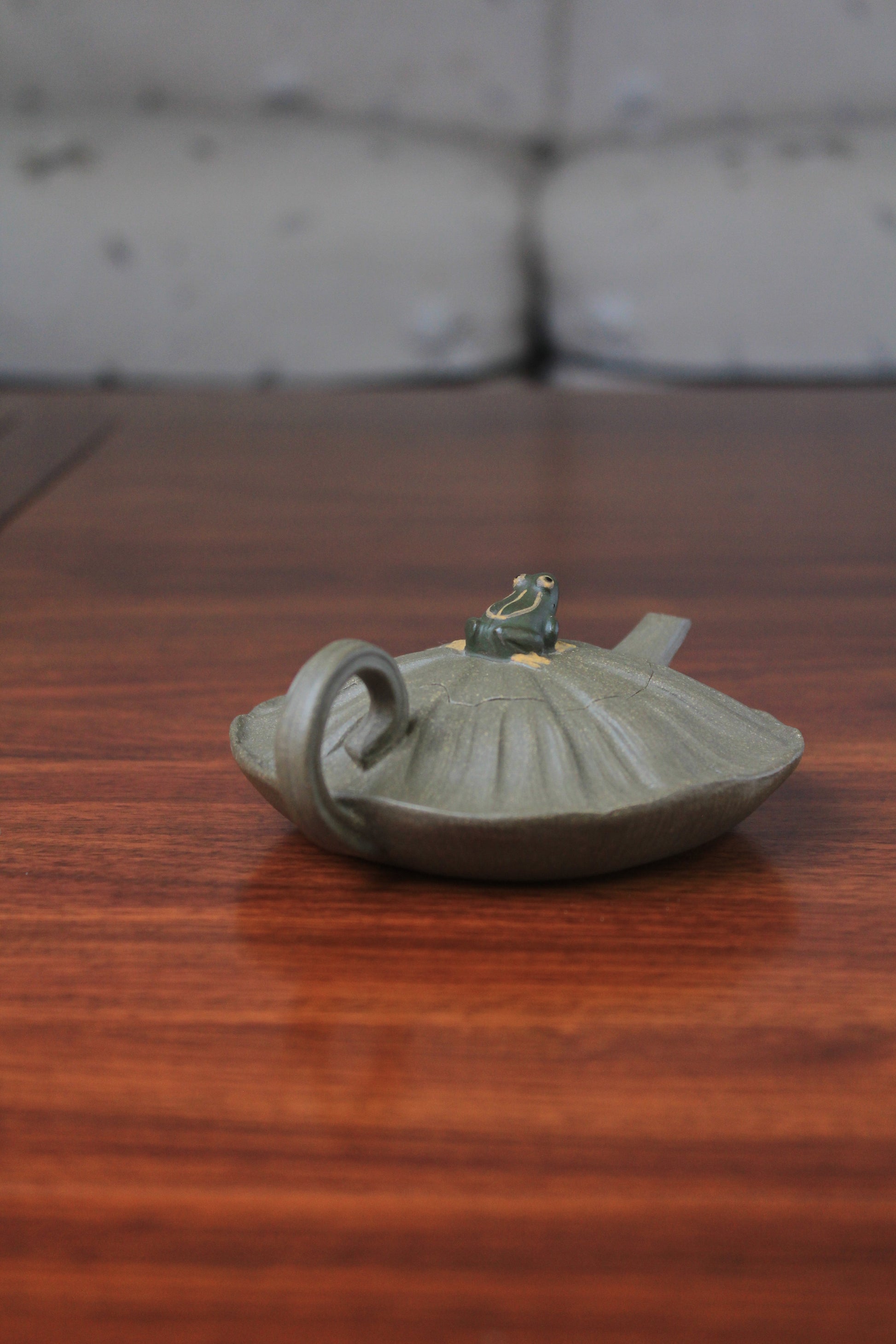 yixing clay teapot on the table left