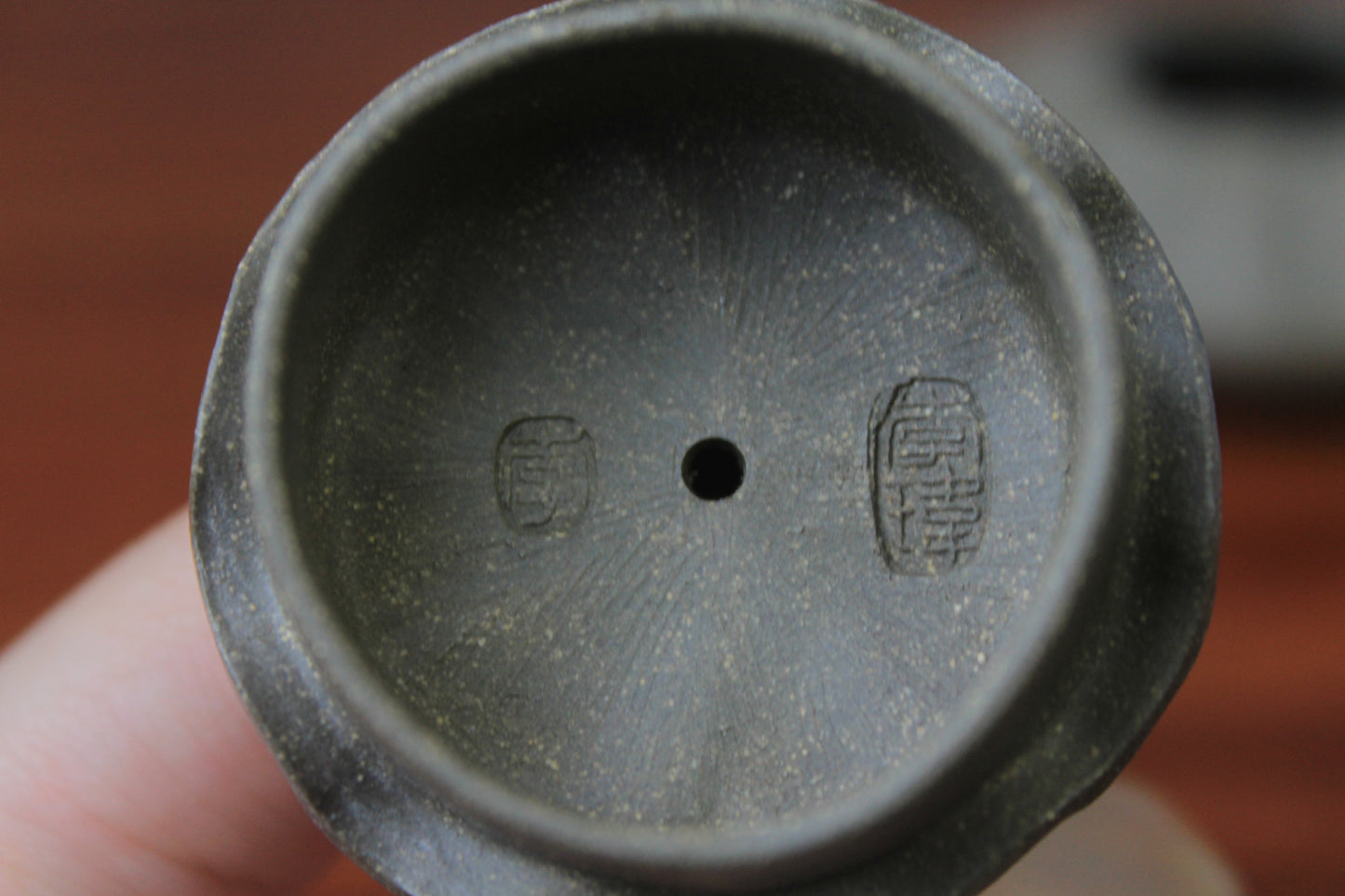 Lid of the yixing clay teapot on the table