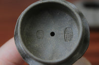 Lid of the yixing clay teapot on the table
