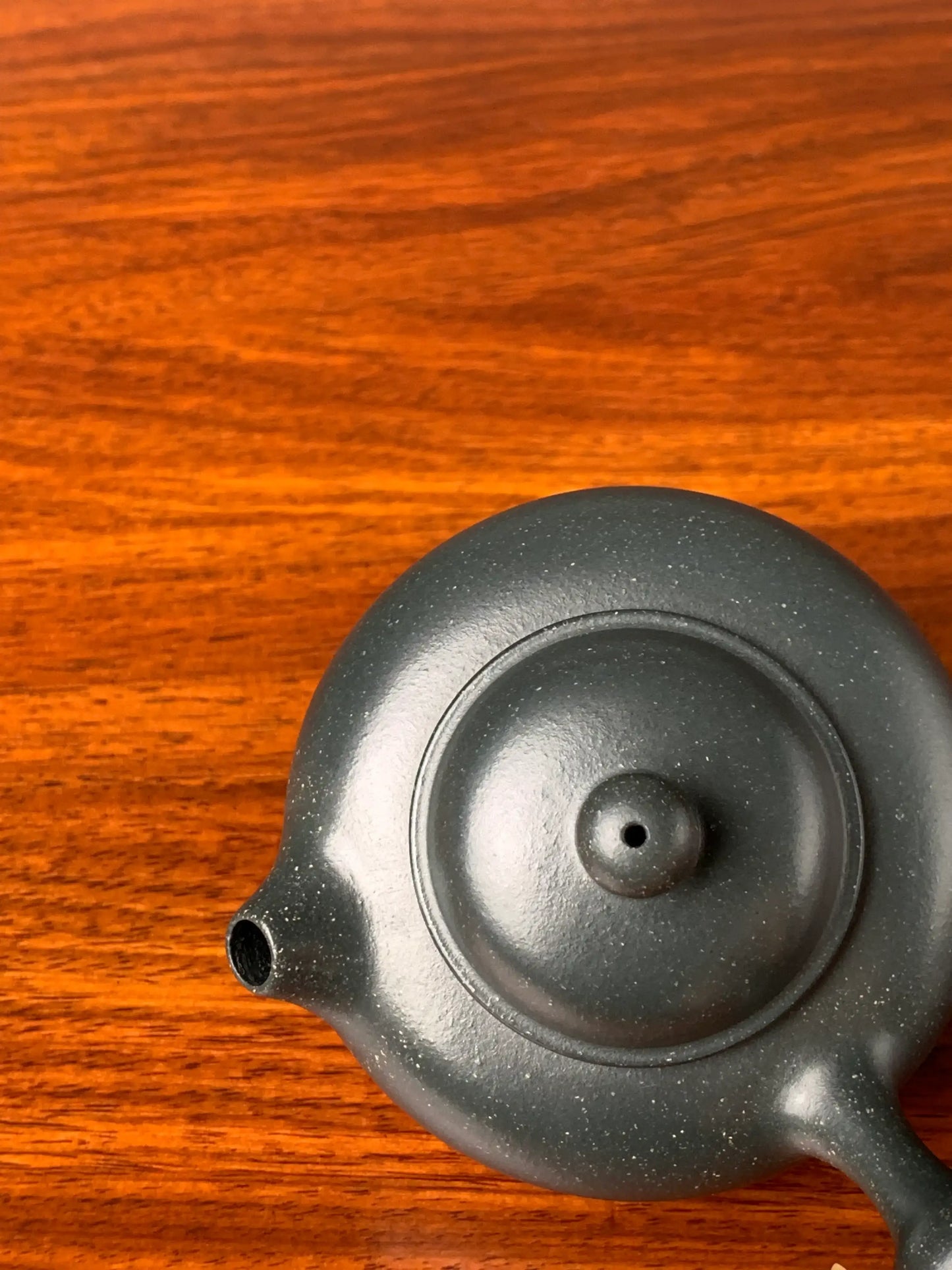 Looking down at the lid and body of the teapot