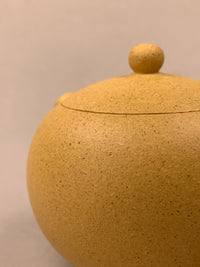 detail of yixing tea pots xi shi on the table
