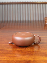 the yixing zisha teapot on the table