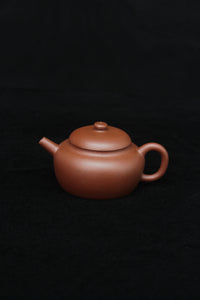 This is a vintage small Yixing teapot made of dicaoqing purple clay