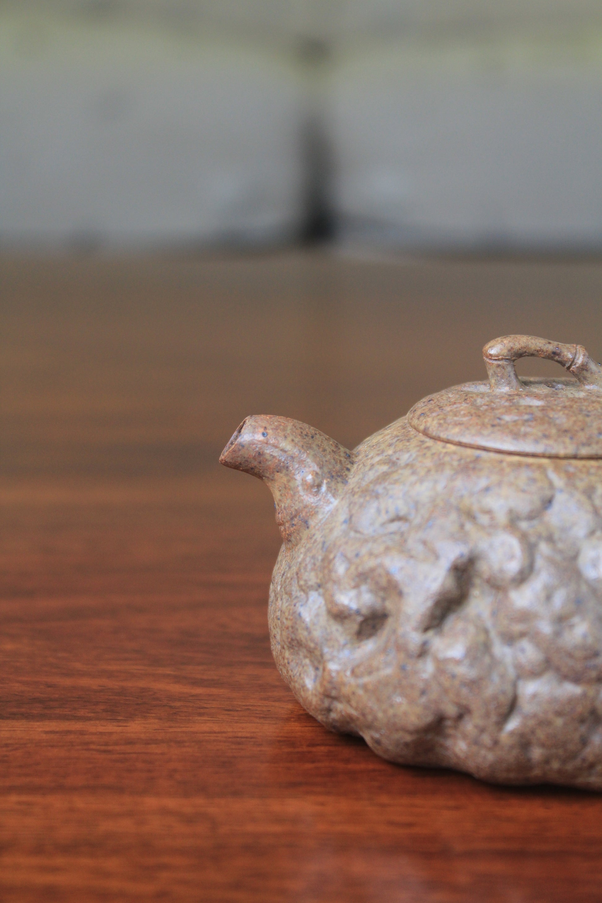 spout of yixing teapot gong chun fully handmade with purple clay on the table