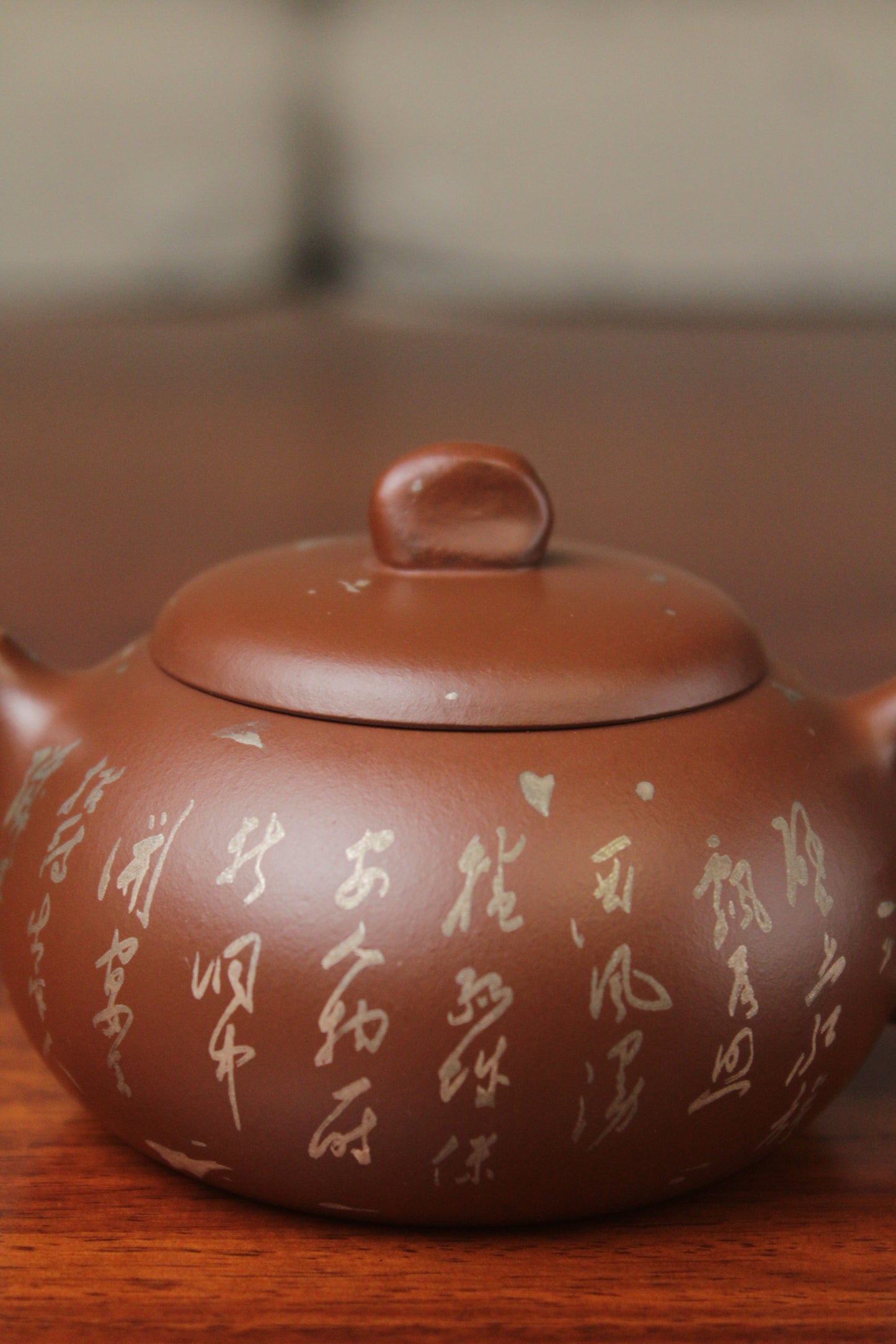 detail of the yixing teapot on the table