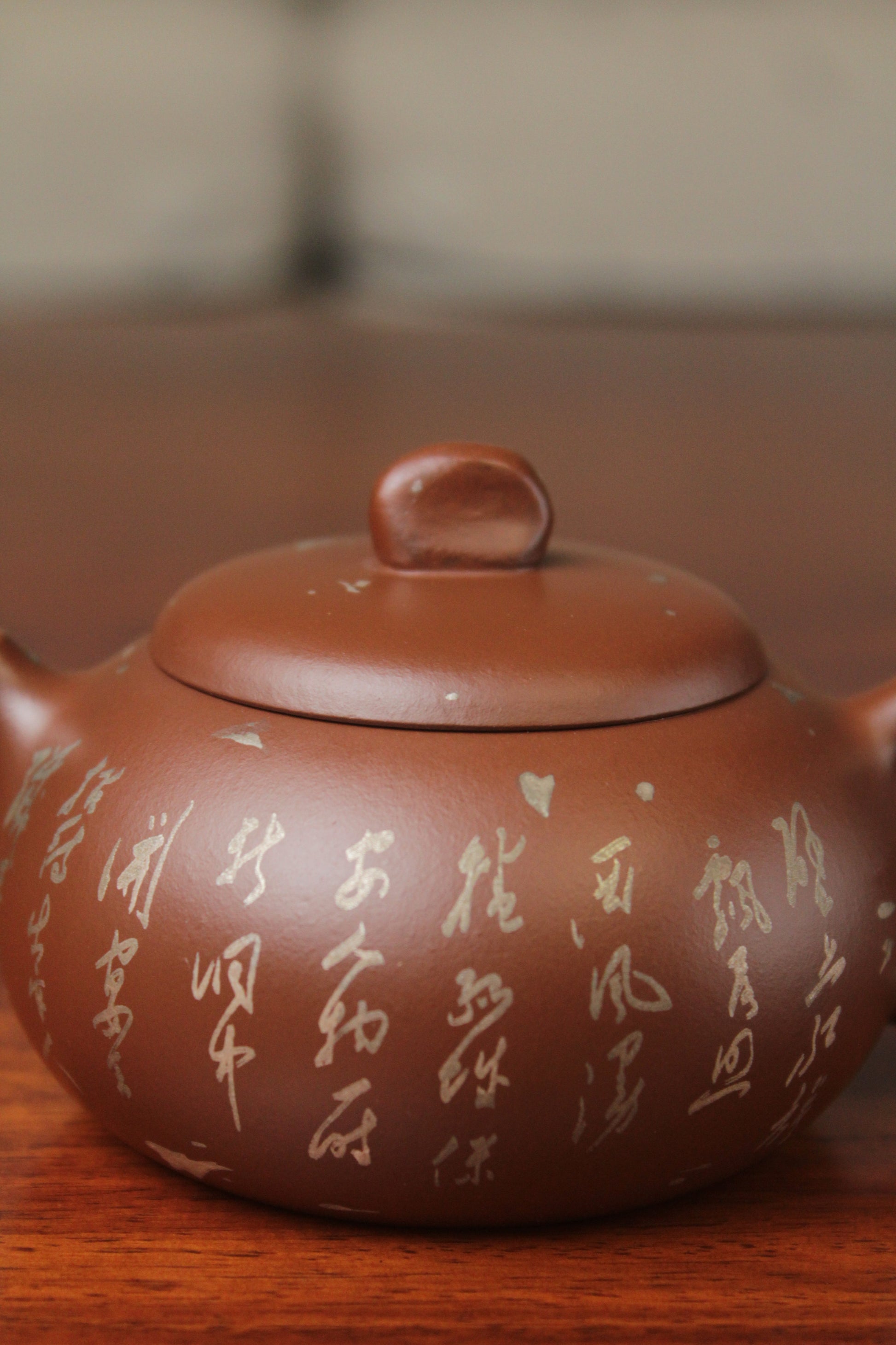 detail of the yixing teapot on the table