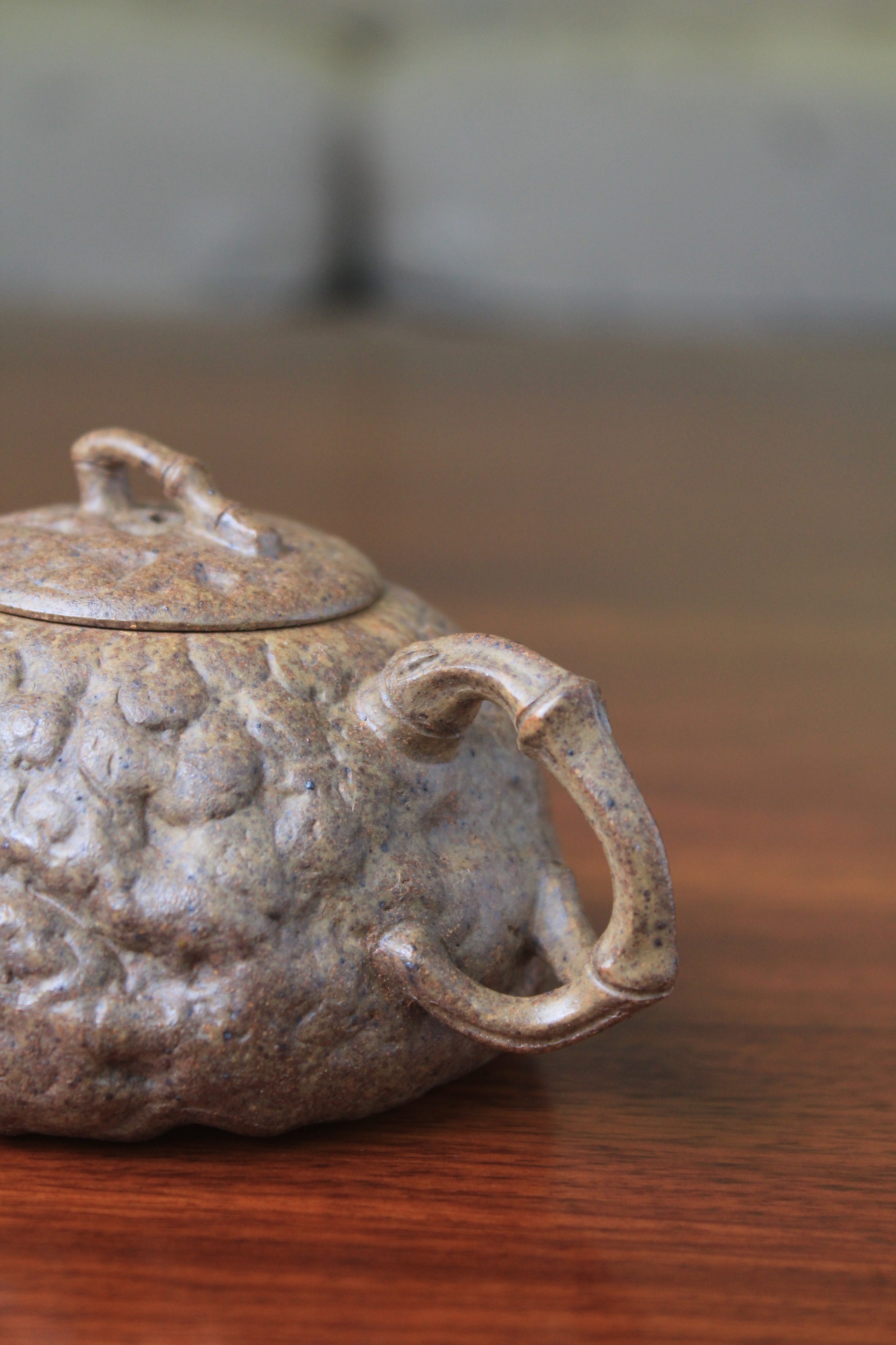 2 handle of yixing teapot gong chun fully handmade with purple clay on the table