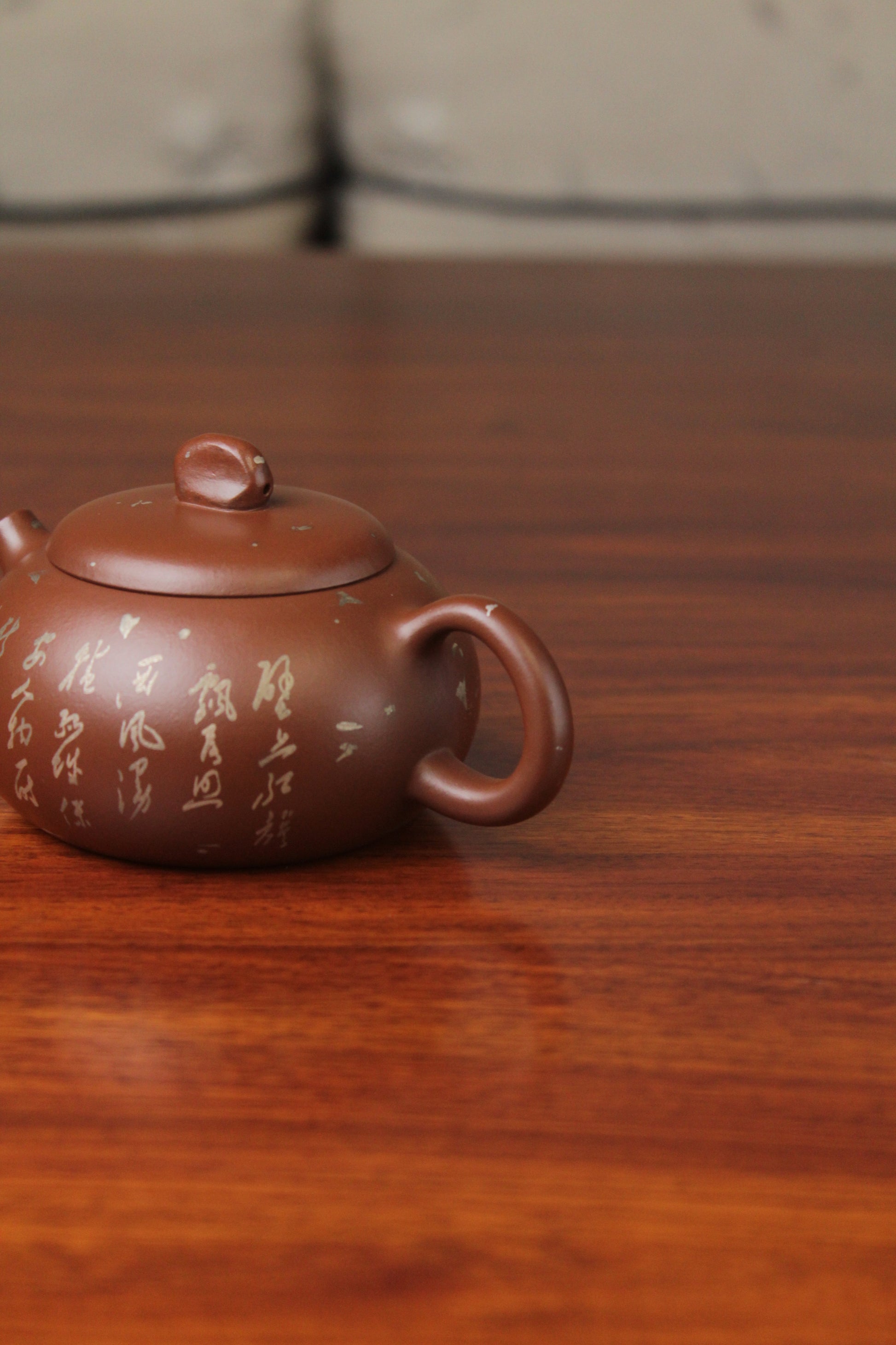 handle of the yixing teapot on the table