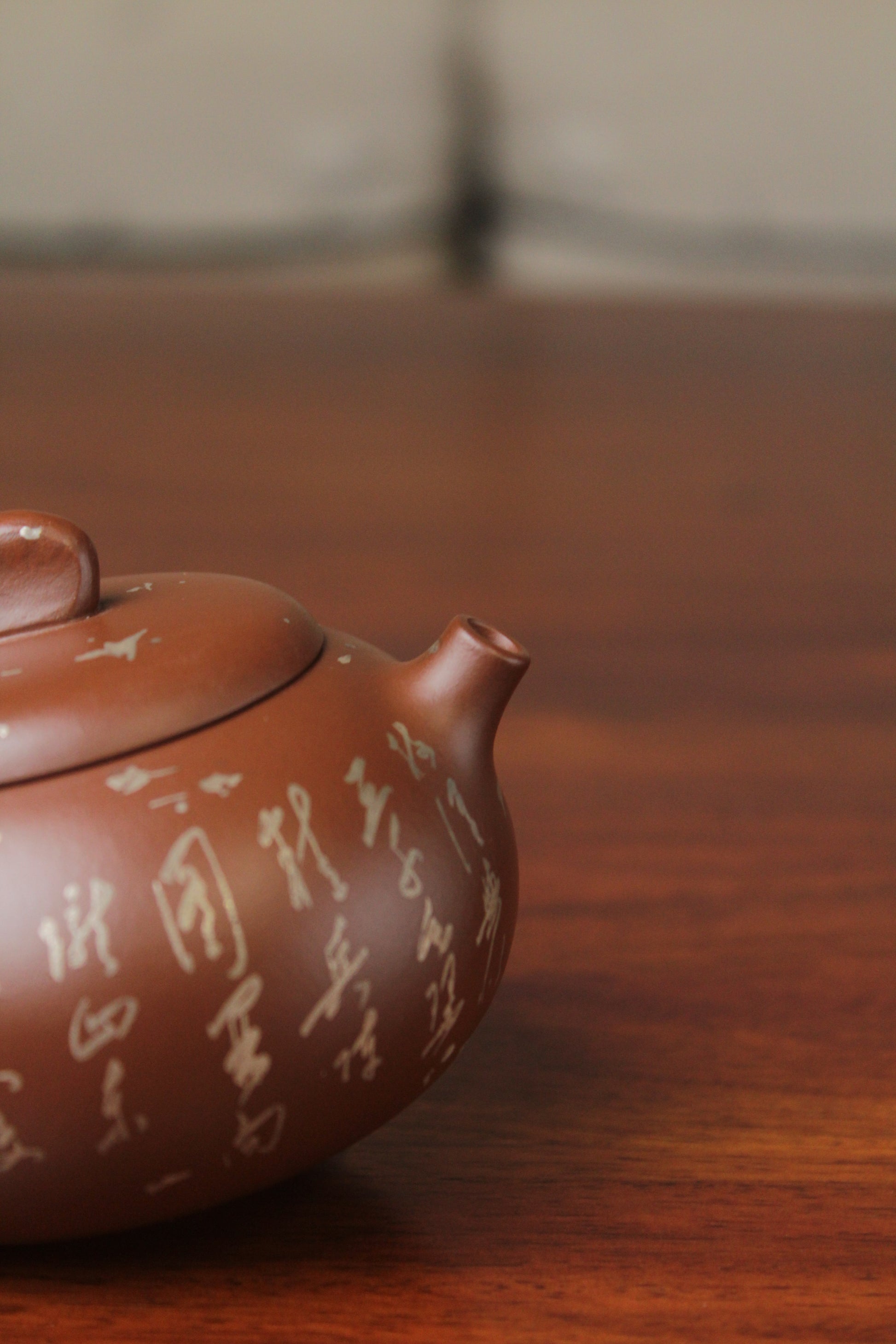 spout of the yixing teapot on the table