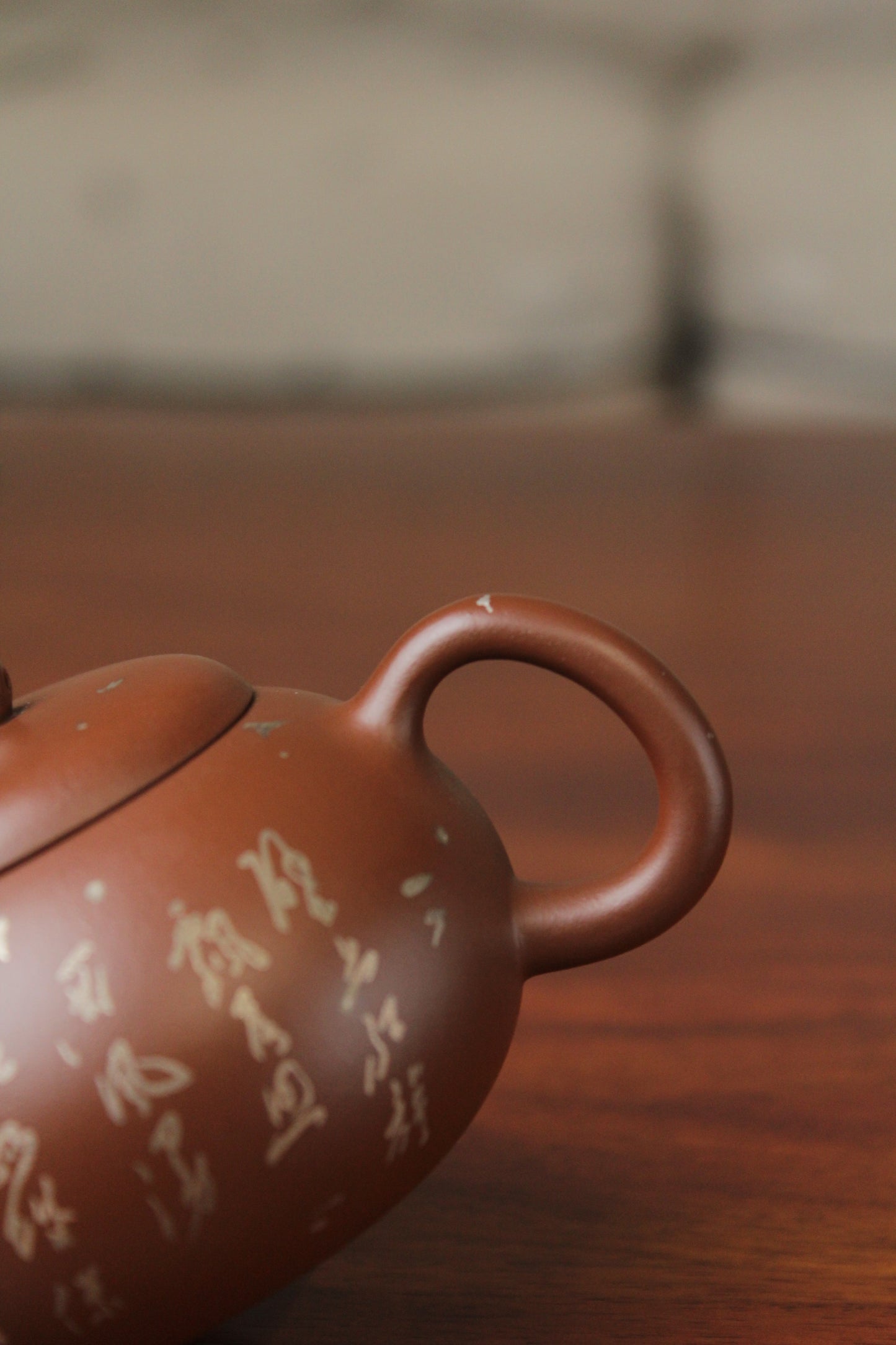 handle of the yixing teapot on the table