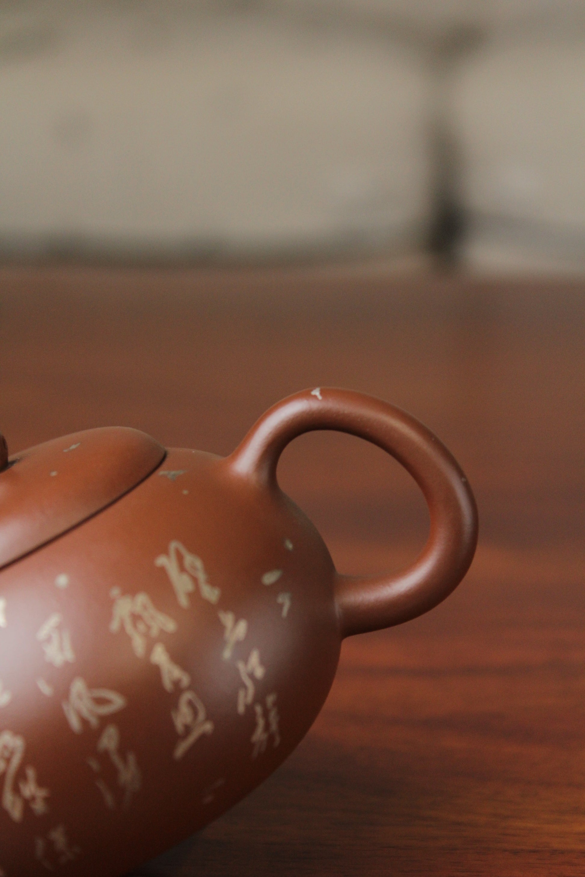 handle of the yixing teapot on the table