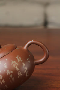 handle of the yixing teapot on the table