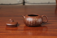Detail of the yixing teapot on the table