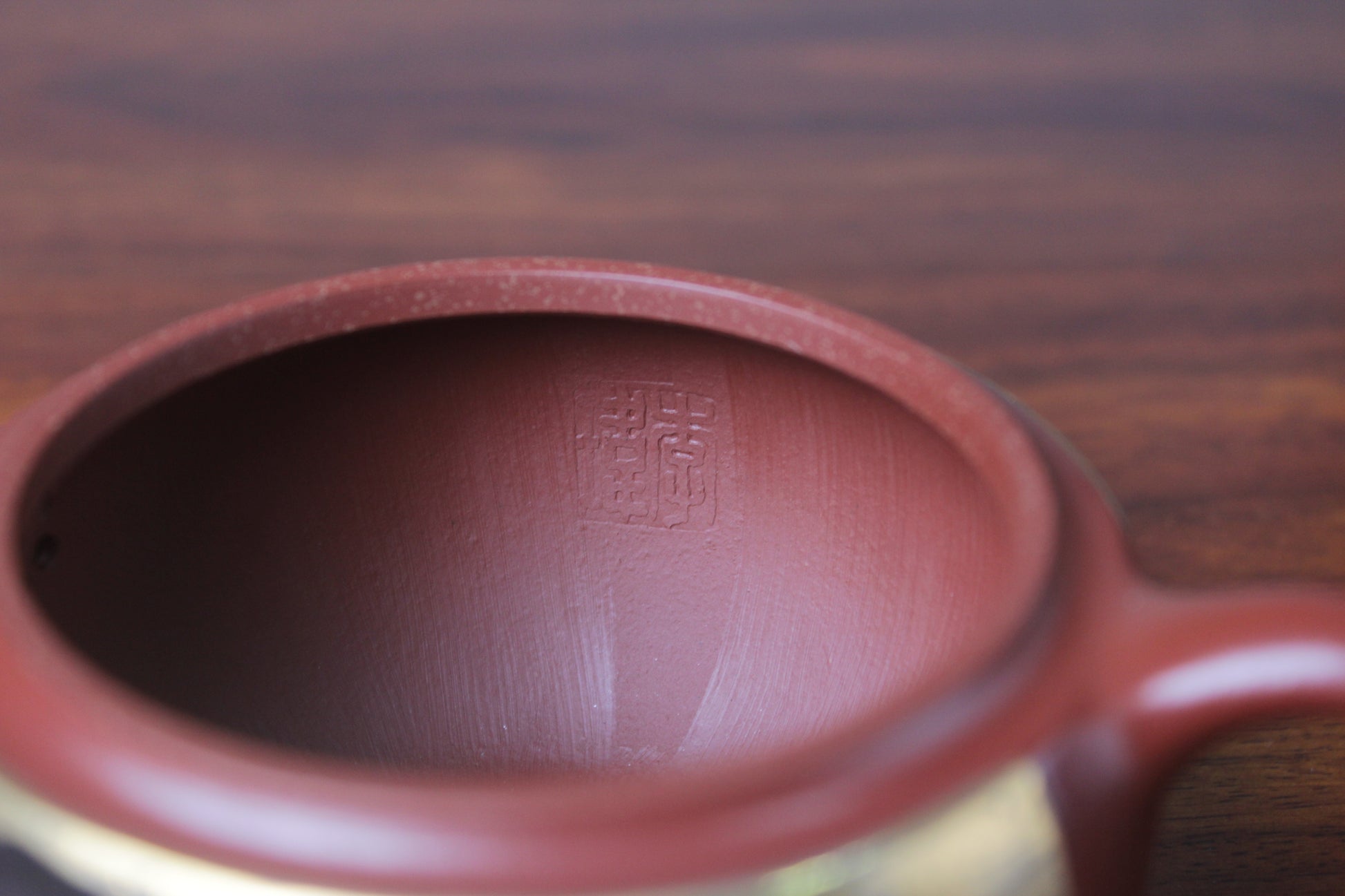 Inside mark of the yixing teapot Han wa on the table