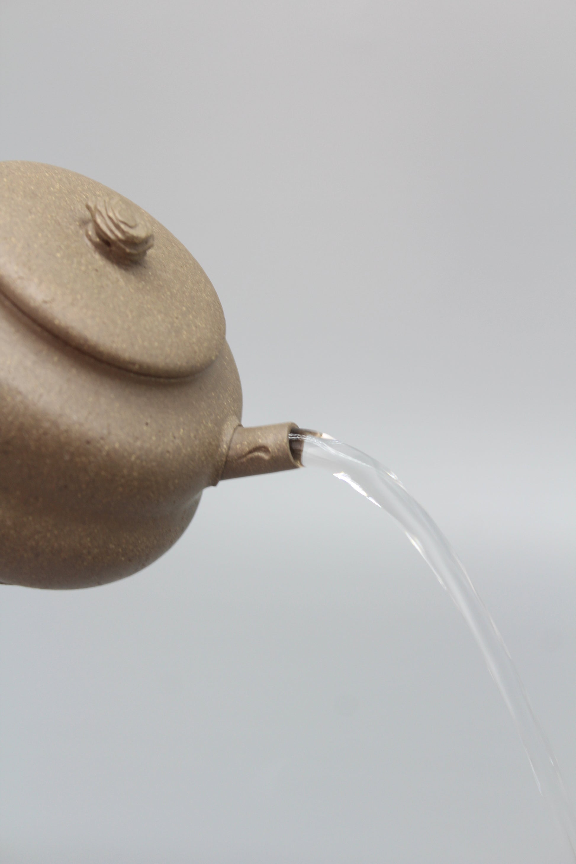 Artistic Yixing teapot pour