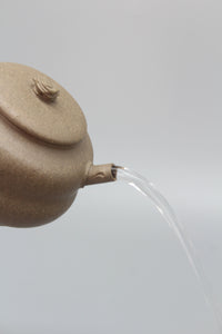 Artistic Yixing teapot pour