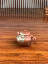 right view of yixing teapot xiang yu on the table