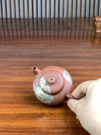 front view of yixing teapot on the table