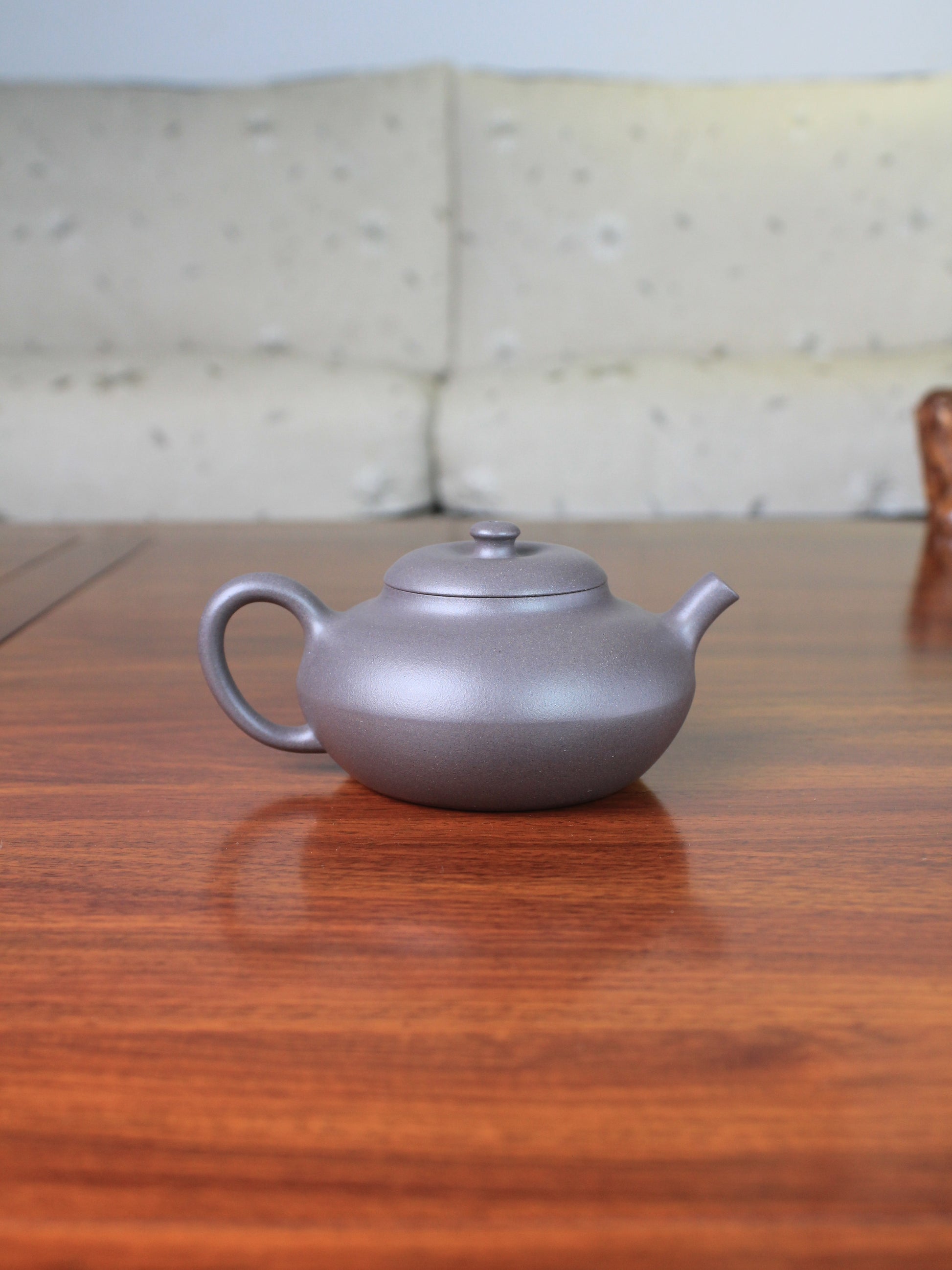 Back view of yixing teapot handmade named he huan