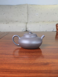 Back view of yixing teapot handmade named he huan
