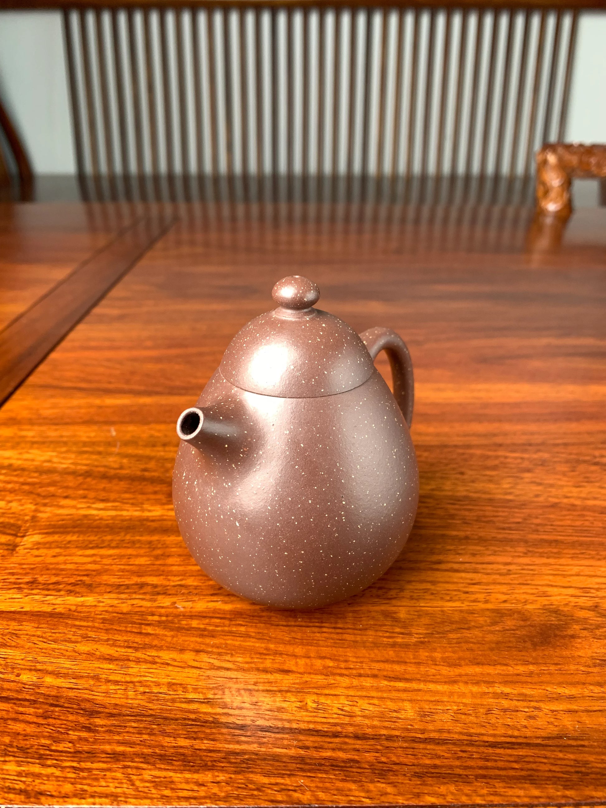 the right view of the yixing teapot on the table
