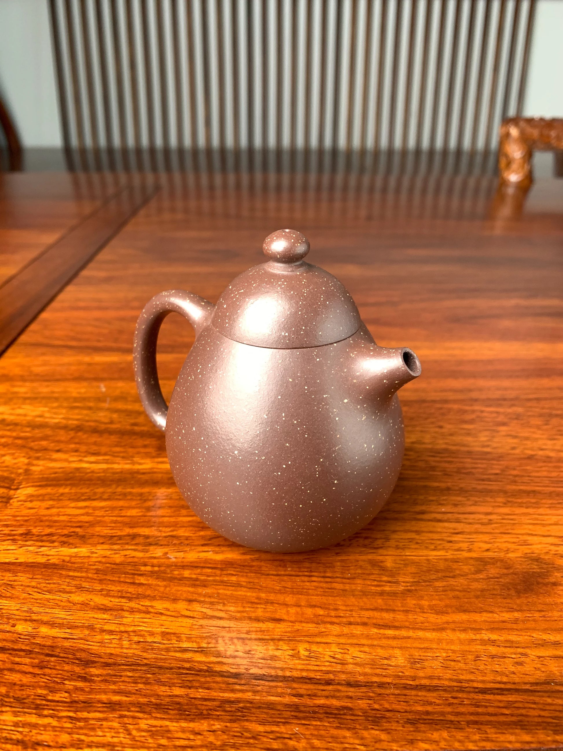 the left view of the yixing teapot on the table