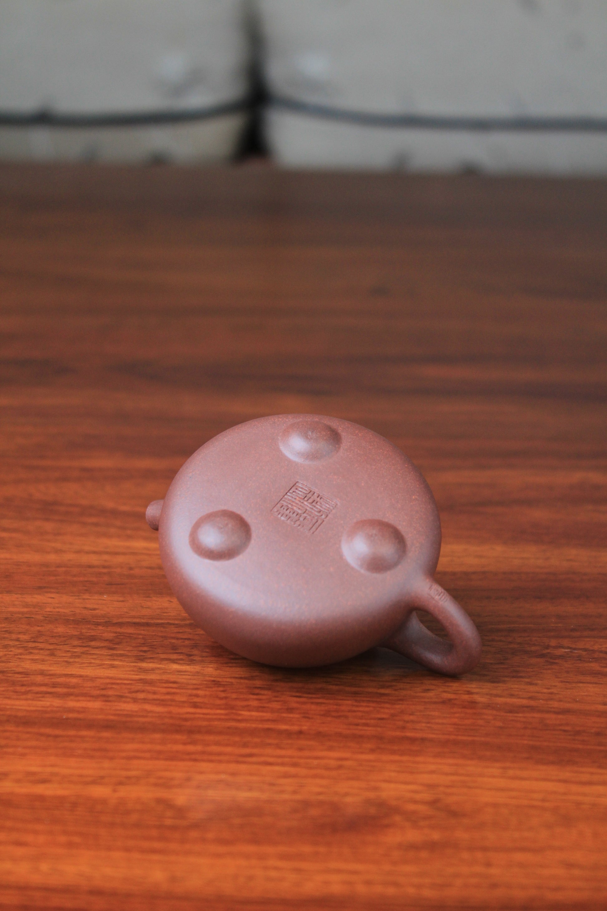 Bottom of the collectible teapot from yixing on the table