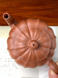 View this yixing teapot from a top-down angle