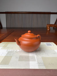 the yixing teapot handmade with yixing ben shan zhuni clay left view