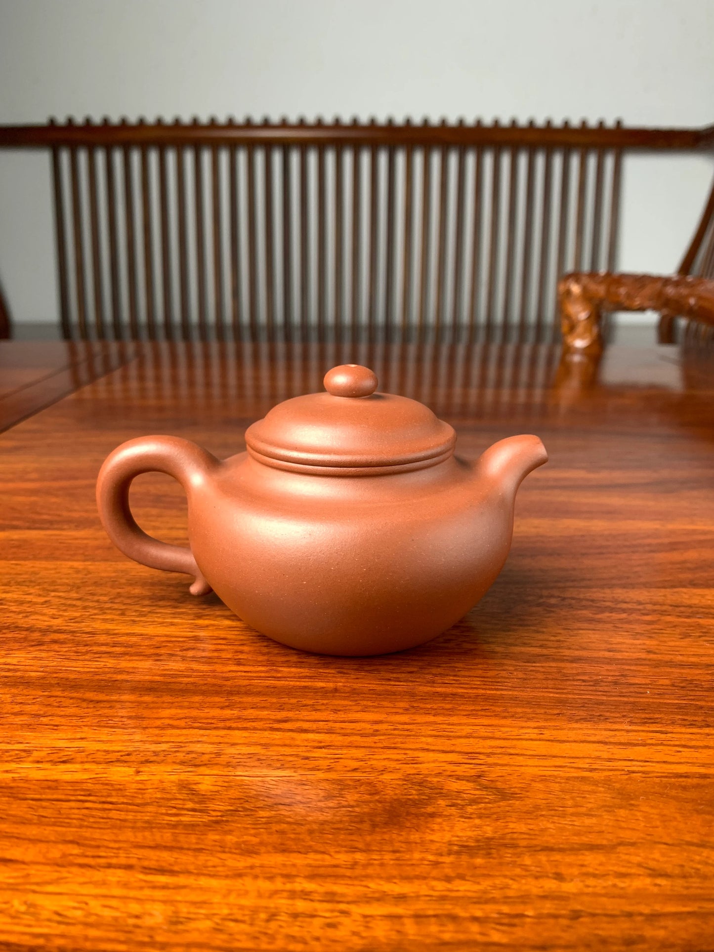 handmade yixing teapot named fang gu on the table back view