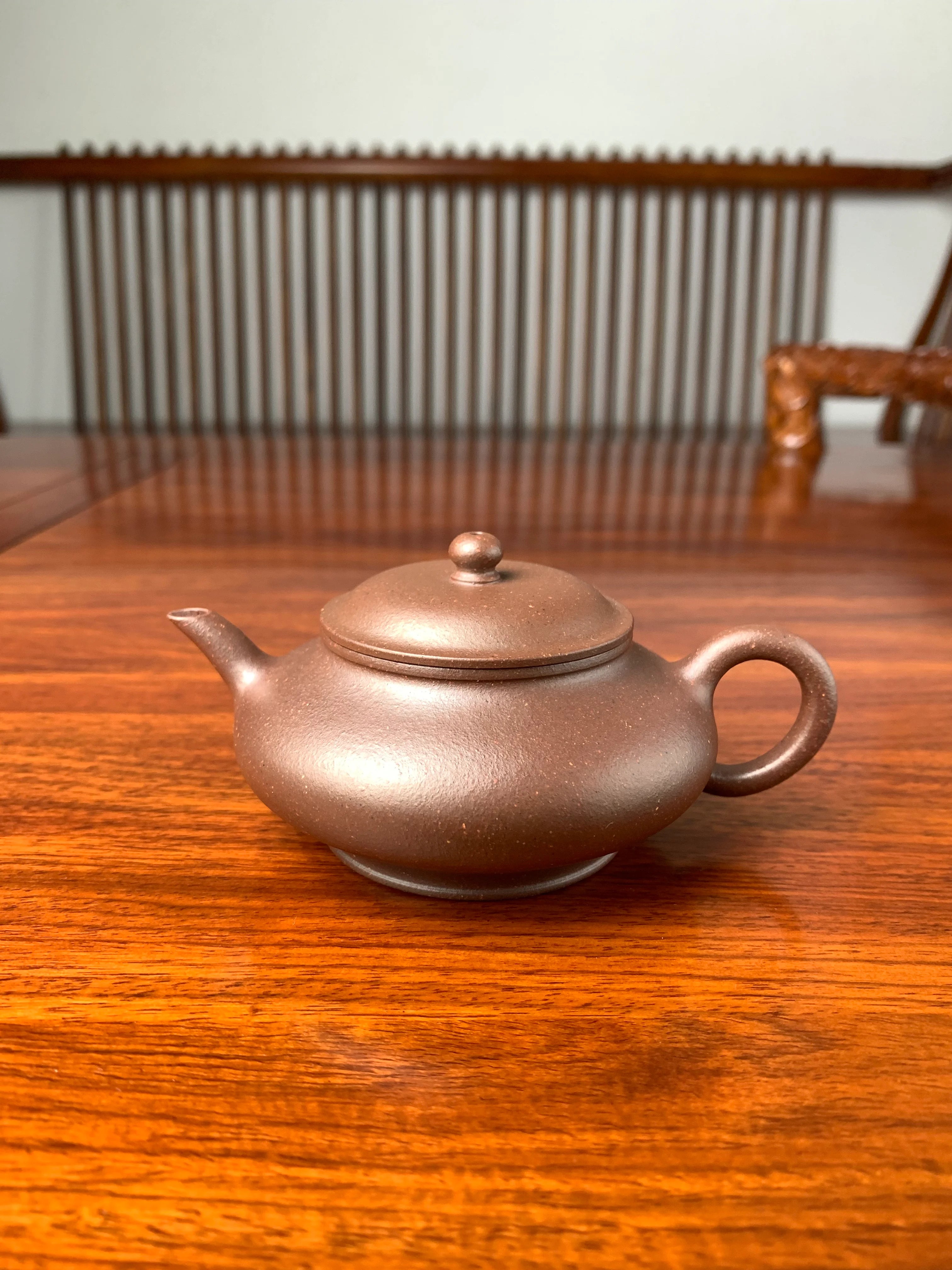 handmade yixing teapot named xu bian on the table