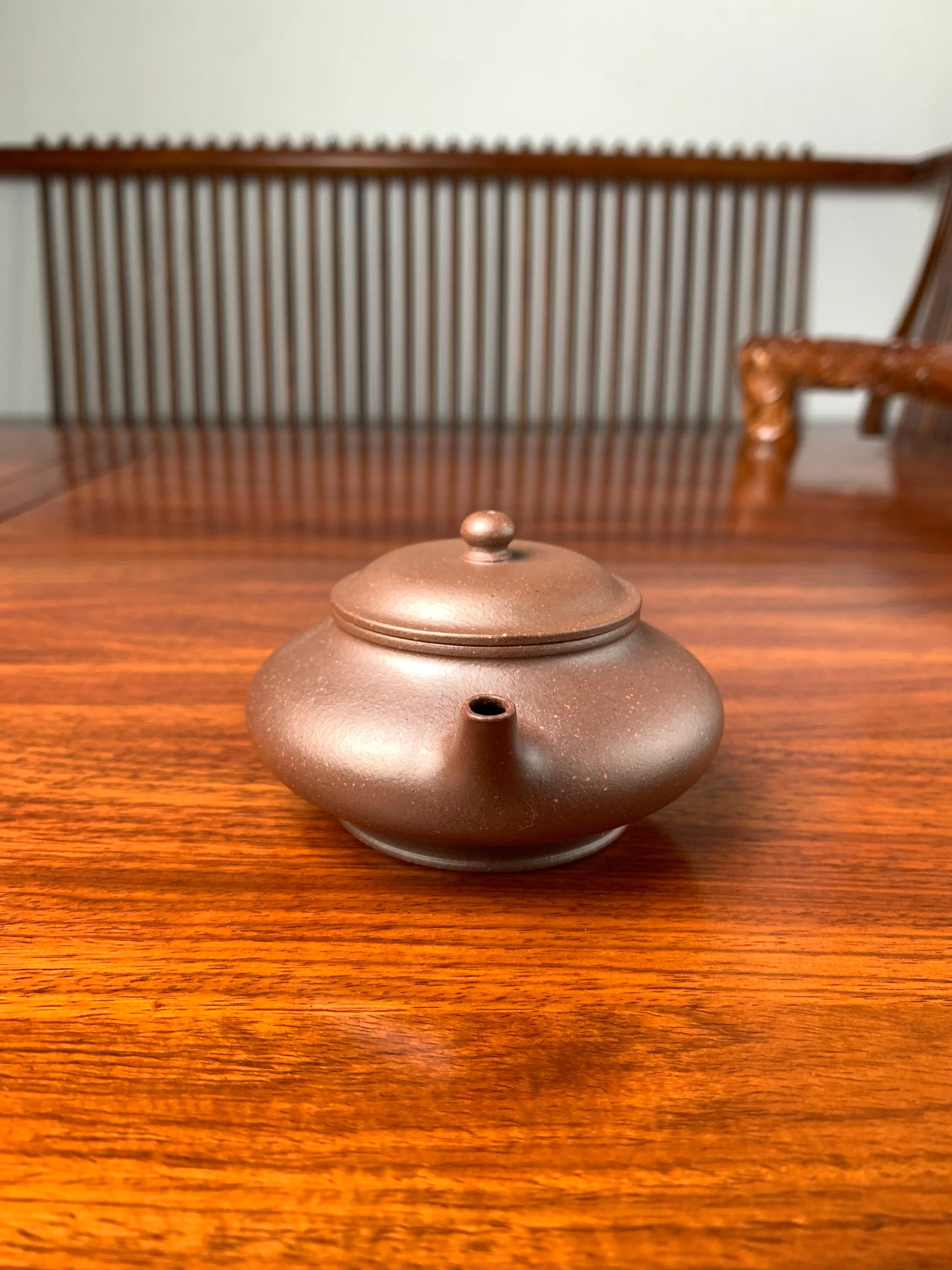 handmade yixing teapot named xu bian on the table front view