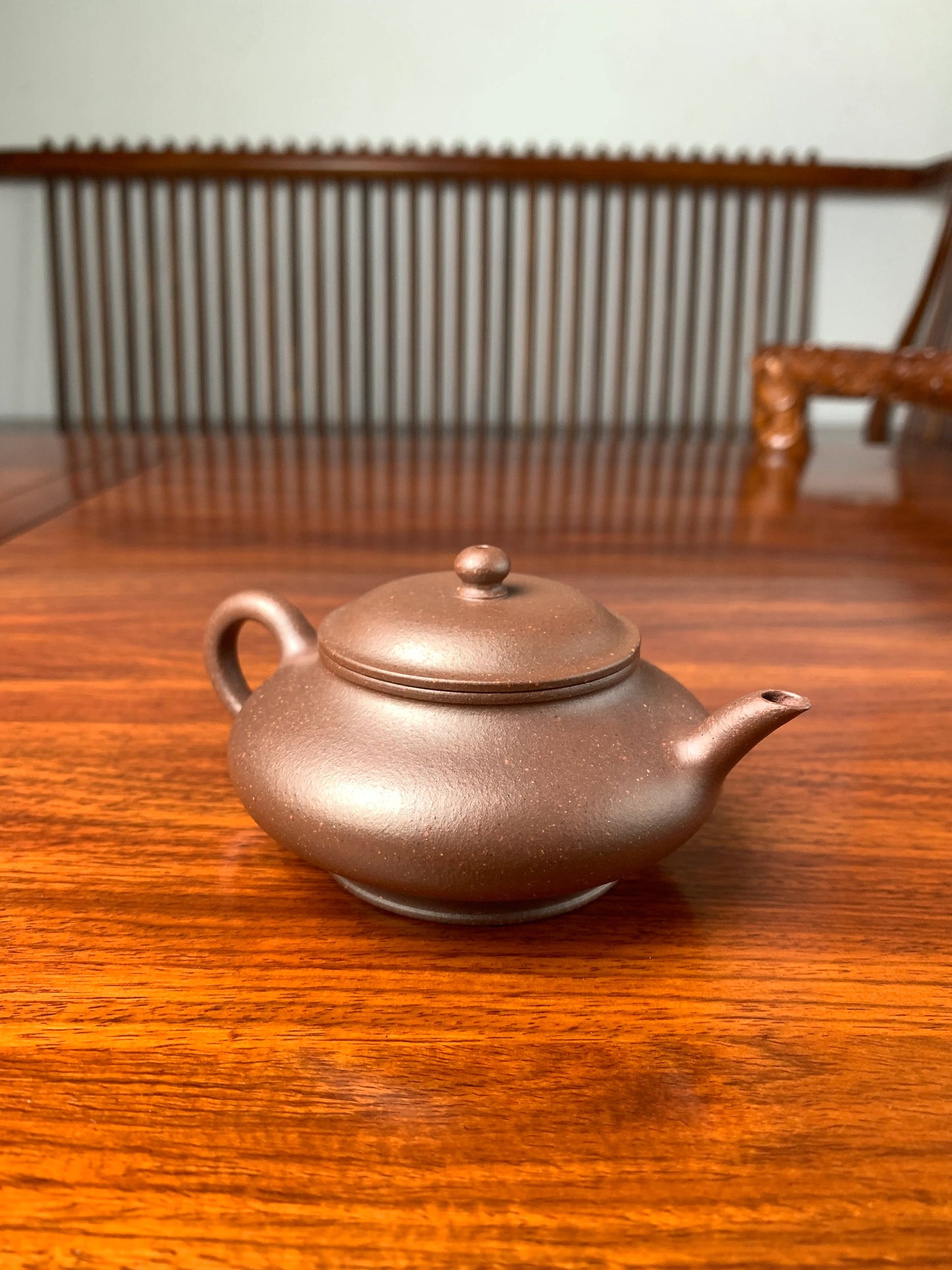 handmade yixing teapot named xu bian on the table left view