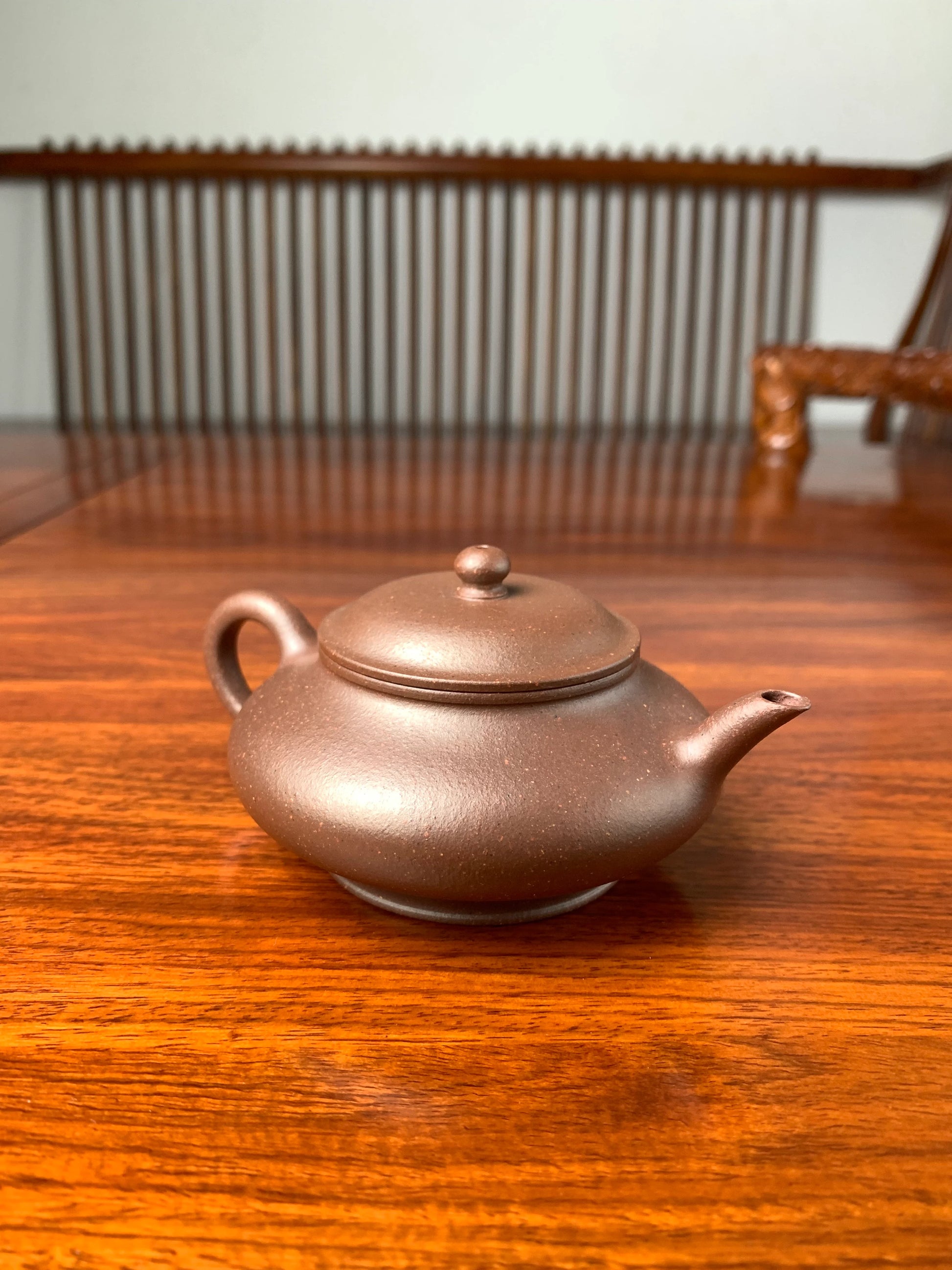 handmade yixing teapot named xu bian on the table left view